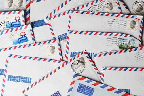 Stack of mailed envelopes illustrating the history of ZIP codes and their role in mail delivery.