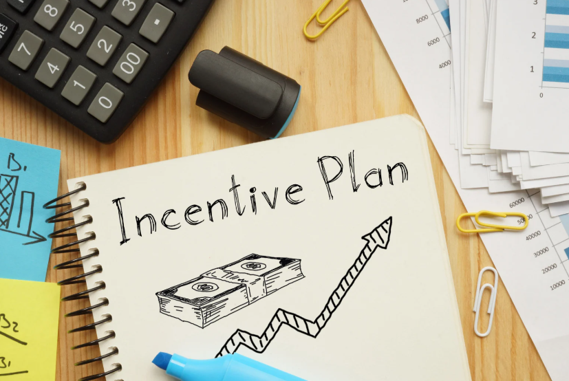 Notebook showing an incentive plan, illustrating how incentives shape behavior through rewards and outcomes.