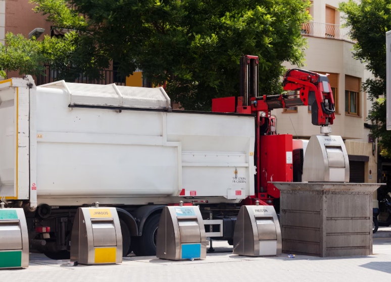 Recycling truck collecting neighborhood bins, illustrating how recycling programs work.