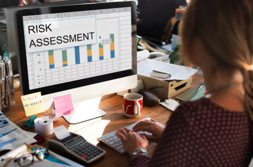 Woman reviewing a risk assessment chart, illustrating personal risk assessment and everyday decision-making.