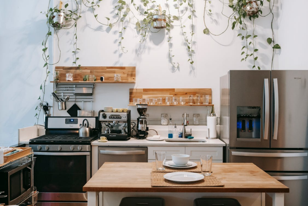 Modern kitchen with household appliances, illustrating the history of household products and changing daily routines.