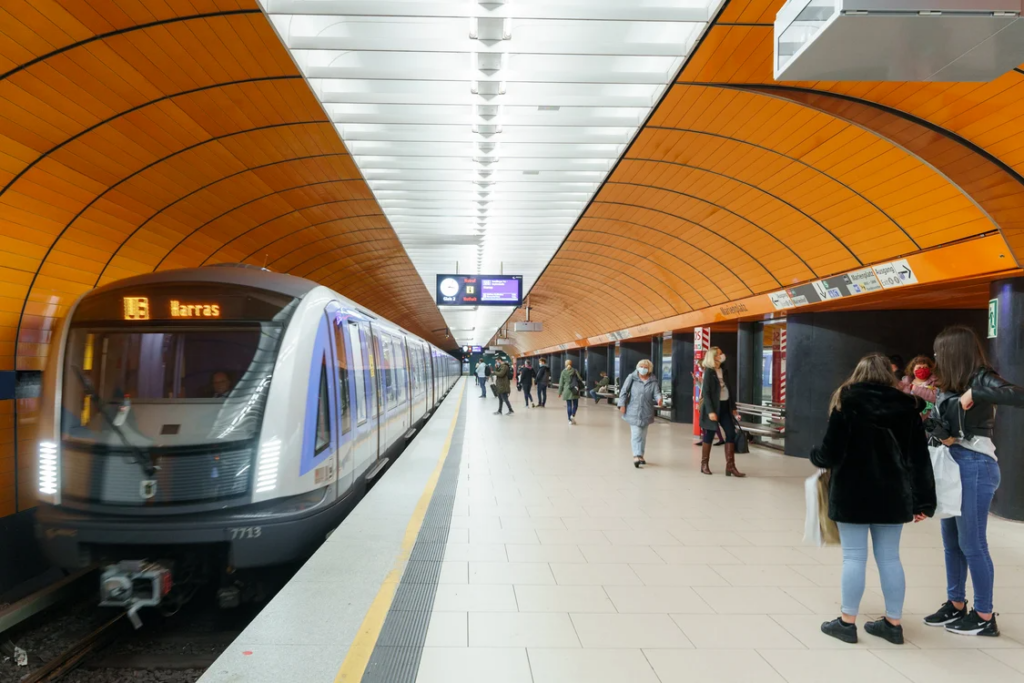 Modern subway station with commuters, illustrating why public transit is better in some cities.