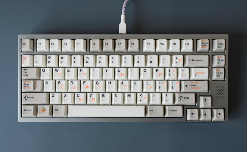 Vintage-style keyboard showing the QWERTY keyboard layout and its lasting influence on modern typing.