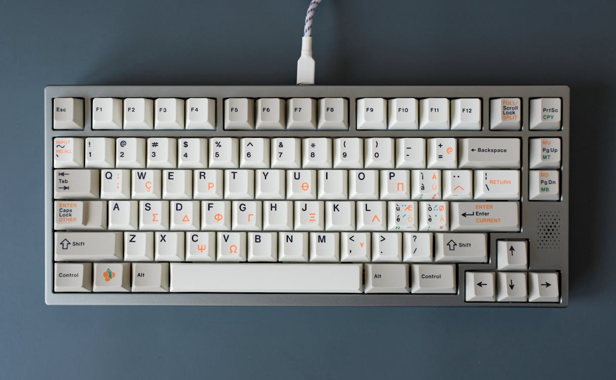 Vintage-style keyboard showing the QWERTY keyboard layout and its lasting influence on modern typing.